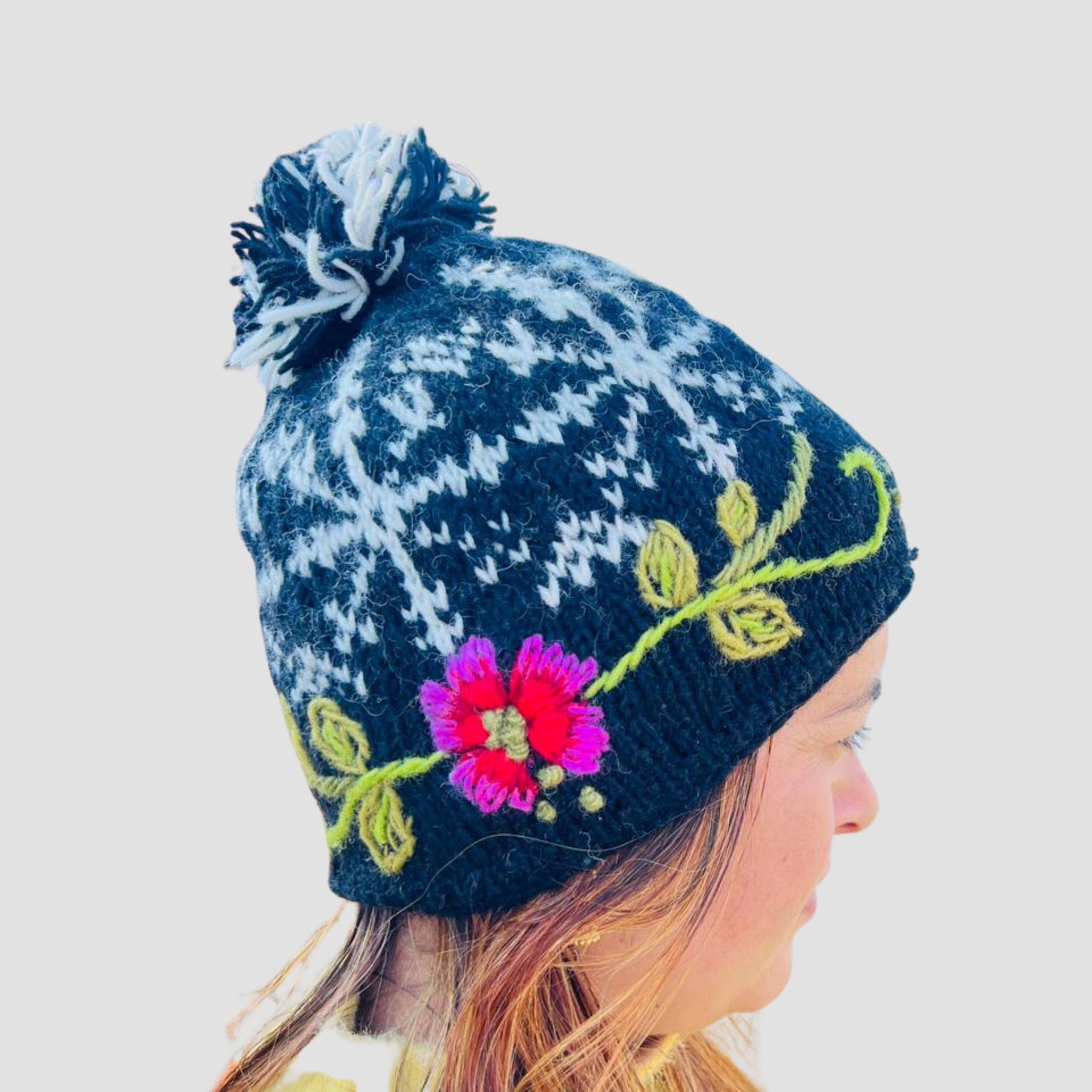 Hand-Knitted Floral Wool Pom Pom Hat | Fair Trade Nepal Beanie