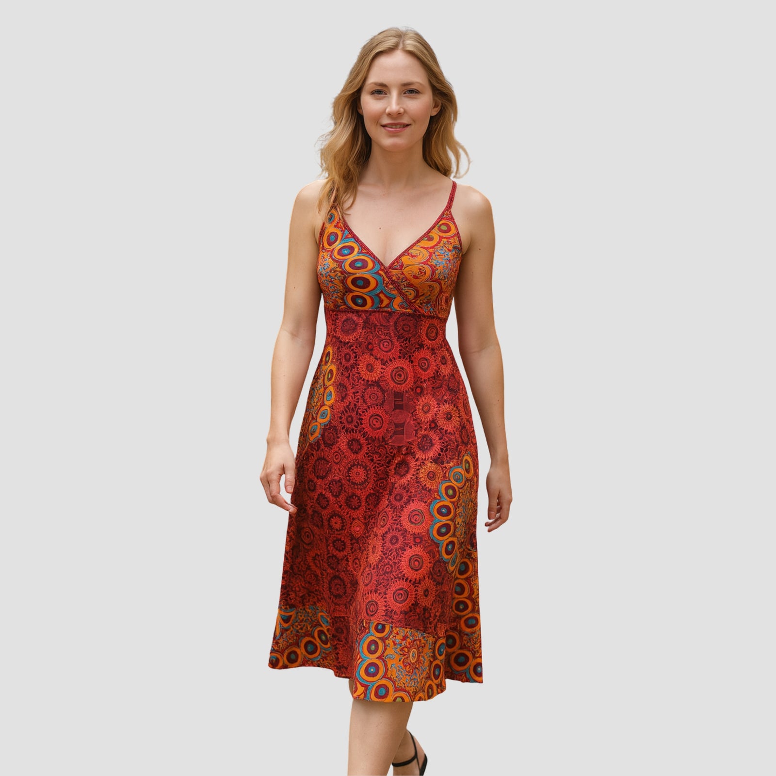 Woman wearing boho-style red dress with floral and mandala hand-block print designs