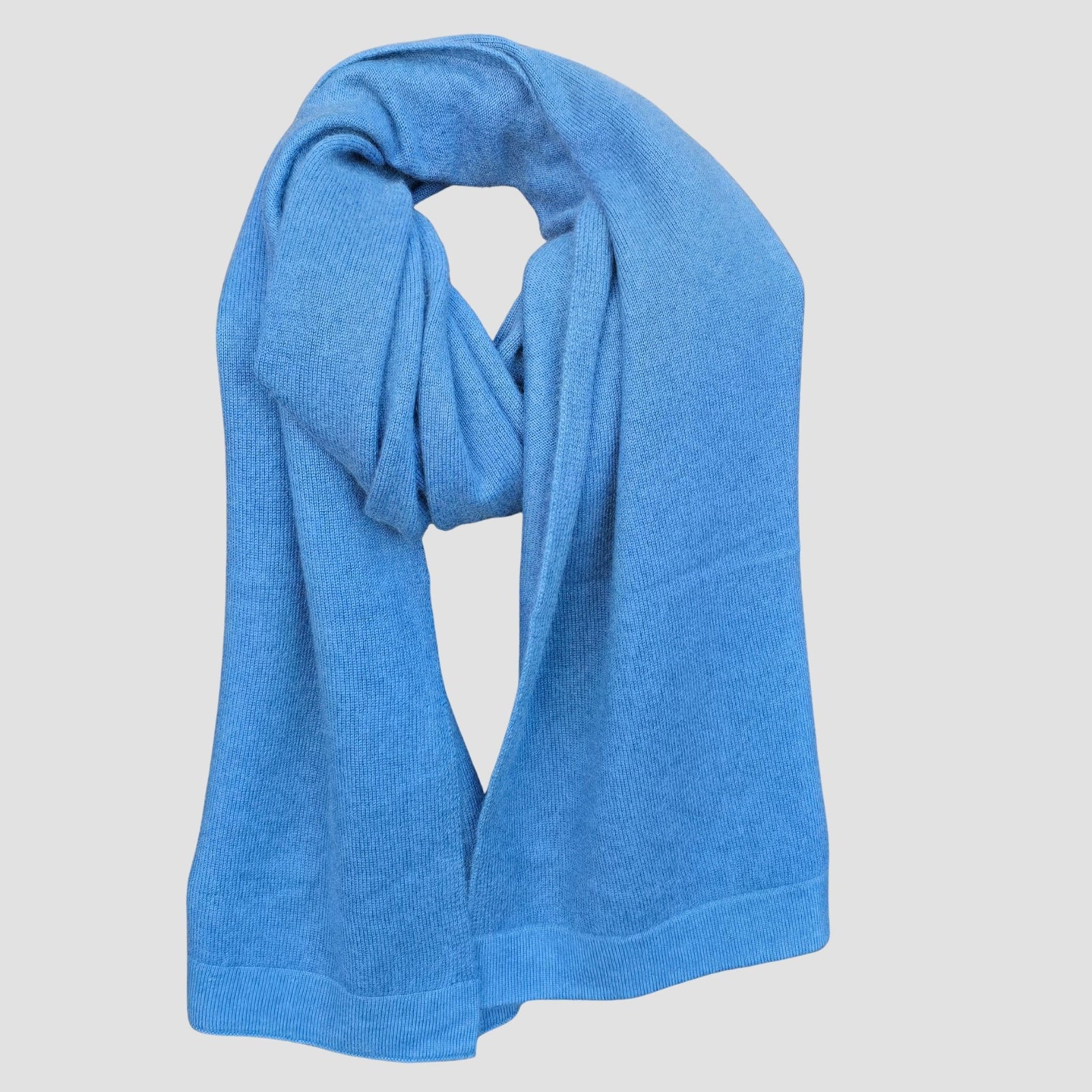 Pure cashmere knit scarf wrap draped and looped showing soft drape and fine knit texture handmade in Nepal