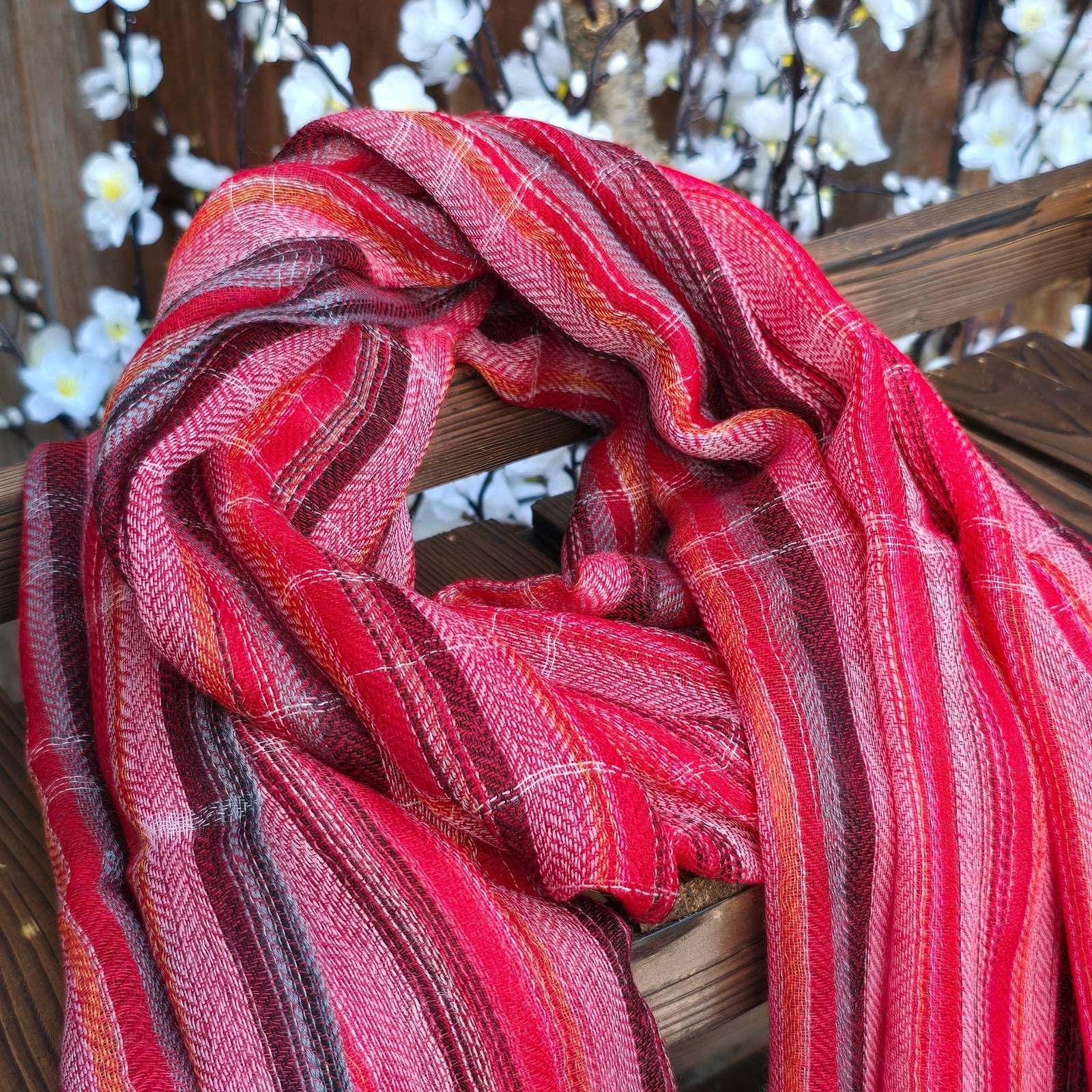 Multicolor stripe handloom cashmere scarf draped showing fluid drape and herringbone weave handmade in Nepal